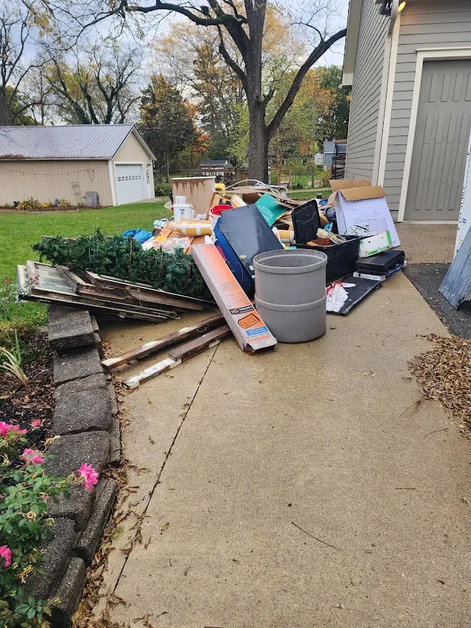 Dumpster being loaded with debris for 3 Yard Dumpster Rental in Buffalo